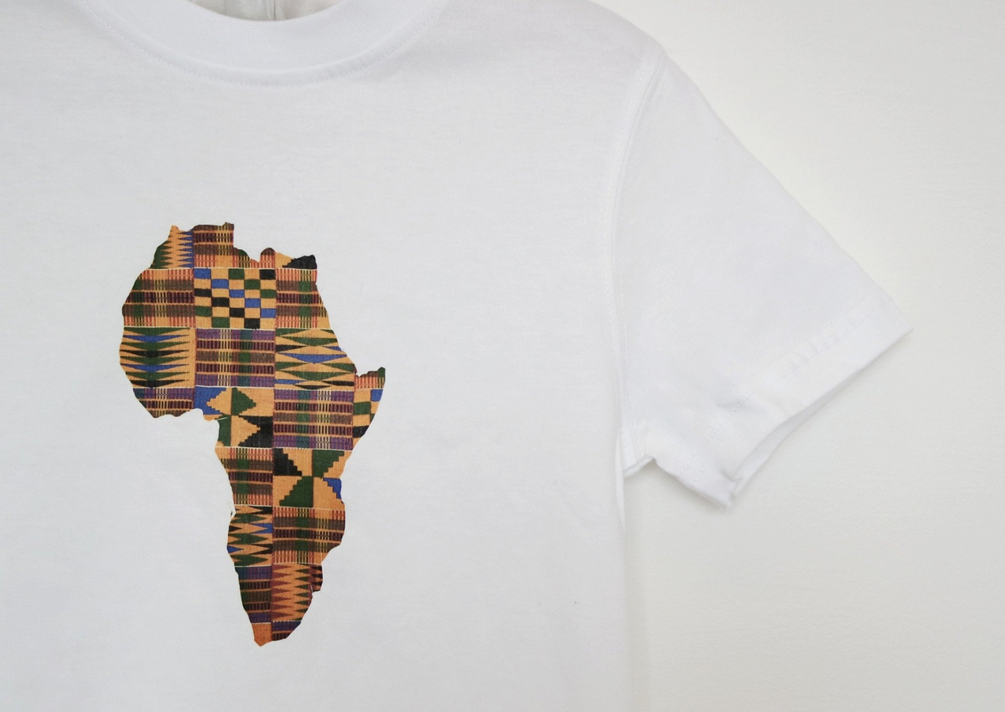 A cute boy's white short sleeve t-shirt with gold map of Africa graphic on the centre.