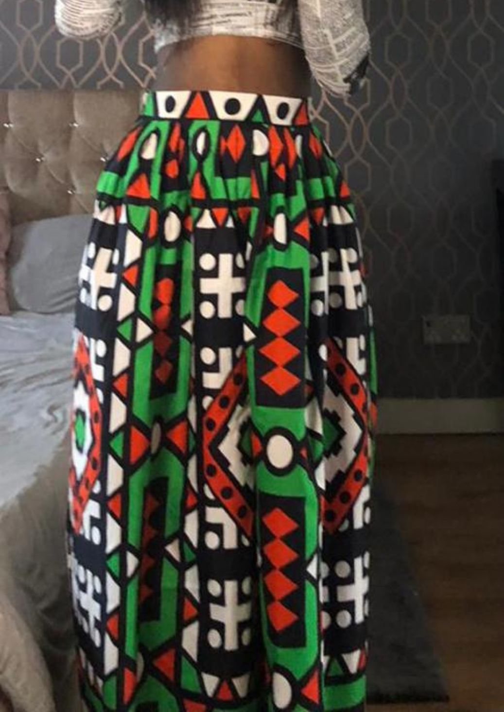 African print maxi skirt with green, red, black and white patterning.