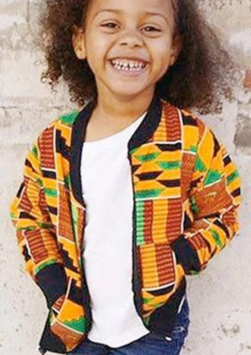 Girls bomber jacket in kente print.