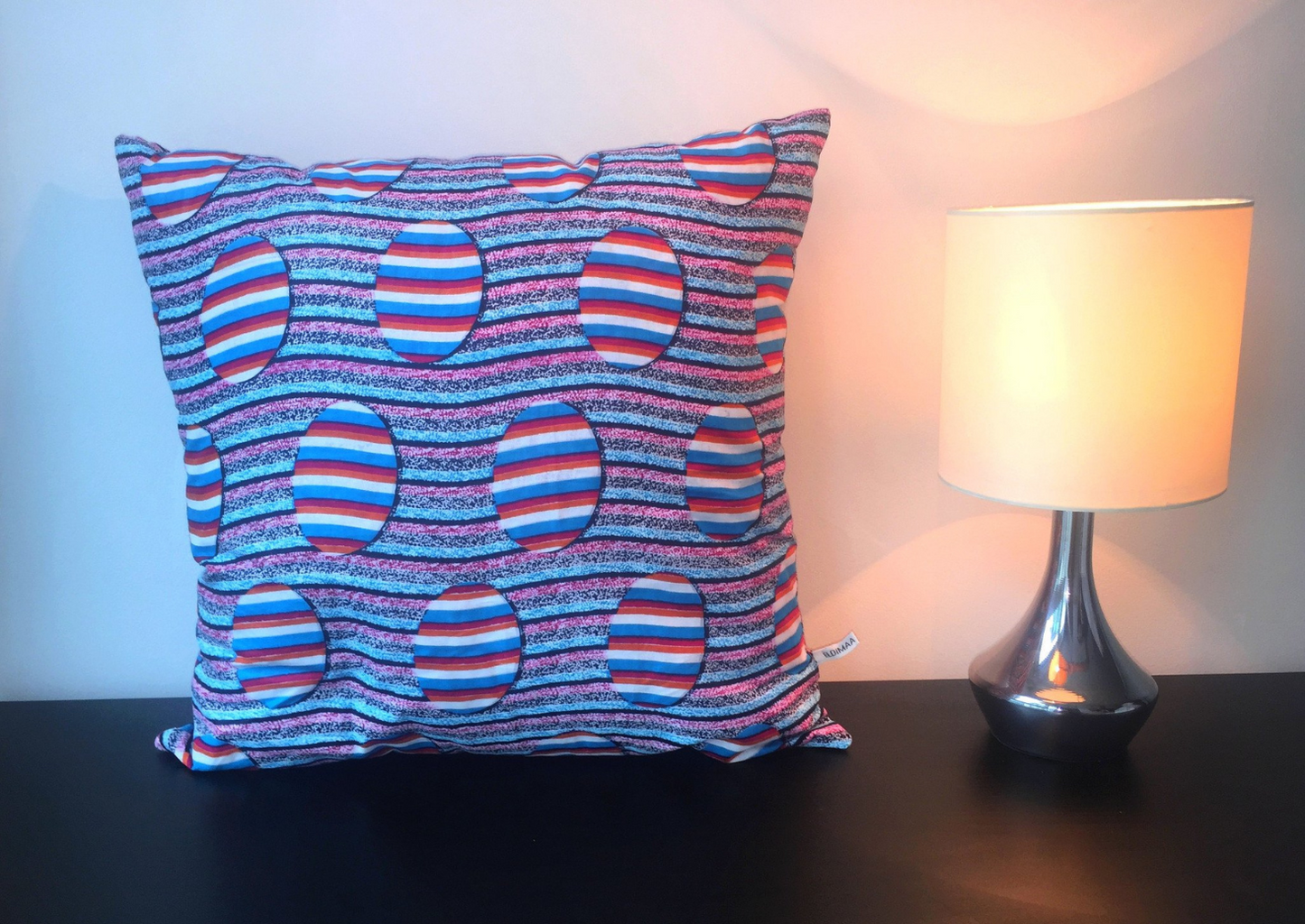 Red and blue African print cushion. This decorative cushion is part of our gorgeous African homeware range.
