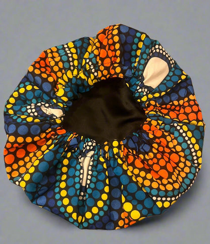 The Buki Ankara African Print Satin Sleeping Bonnet in Yellow, Orange & Blue by Eldimaa Fashion