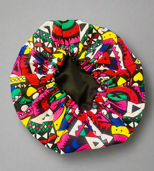 The Buki Ankara African Print Satin Sleeping Bonnet in Hot Pink Colour Pop by Eldimaa Fashion