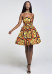 An orange multi way wrap dress, The Lola, is a versatile African print dress that can be styled to match your mood or the occasion. The Ankara style dress can be worn as a chic halter neck midi dress, a sleeveless v neck dress, a wrap dress, a bandeau midi dress, a cross front dress and more. The orange midi dress is perfect for work and social occasions and the wrap skater dress is made to measure.