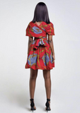 A red multi way wrap dress, The Lola, is a versatile African print dress that can be styled to match your mood or the occasion. The Ankara style dress can be worn as a chic halter neck midi dress, a sleeveless v neck dress, a wrap dress, a bandeau midi dress, a cross front dress and more. The red midi dress is perfect for work and social occasions and the wrap skater dress is made to measure.