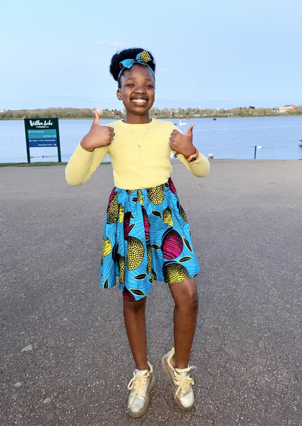 Blue African print a-line skirt for girls, with pink and yellow patterning.