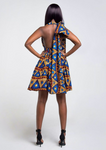 A blue African print multiway midi dress, our model wears the Ankara dress in blue, gold and red as a halter neck dress.