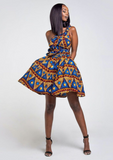 A blue African print multiway midi dress, our model wears the Ankara dress in blue, gold and red as a one shoulder dress.