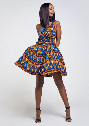 A blue African print multiway midi dress, our model wears the Ankara dress in blue, gold and red as a one shoulder dress.