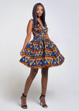 A blue African print multiway midi dress, our model wears the Ankara dress in blue, gold and red as a v cut skater dress.
