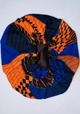 African print satin bonnet, the royal blue, bright orange and black print makes a beautiful sleeping cap.