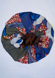African print bonnet in red and blue with a satin lining.