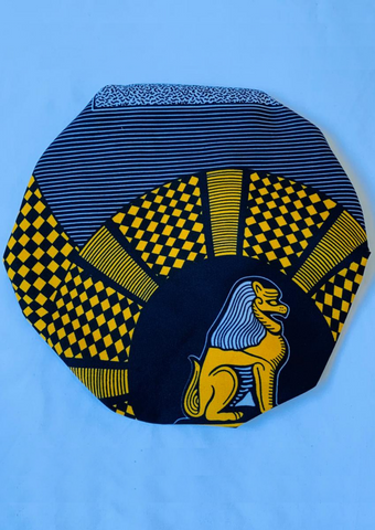 With bold tones of blue and yellow this African print bonnet with satin lining is the perfect statement piece.