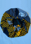 With bold tones of blue and yellow this African print bonnet with satin lining is the perfect statement piece.
