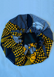 With bold tones of blue and yellow this African print bonnet with satin lining is the perfect statement piece.