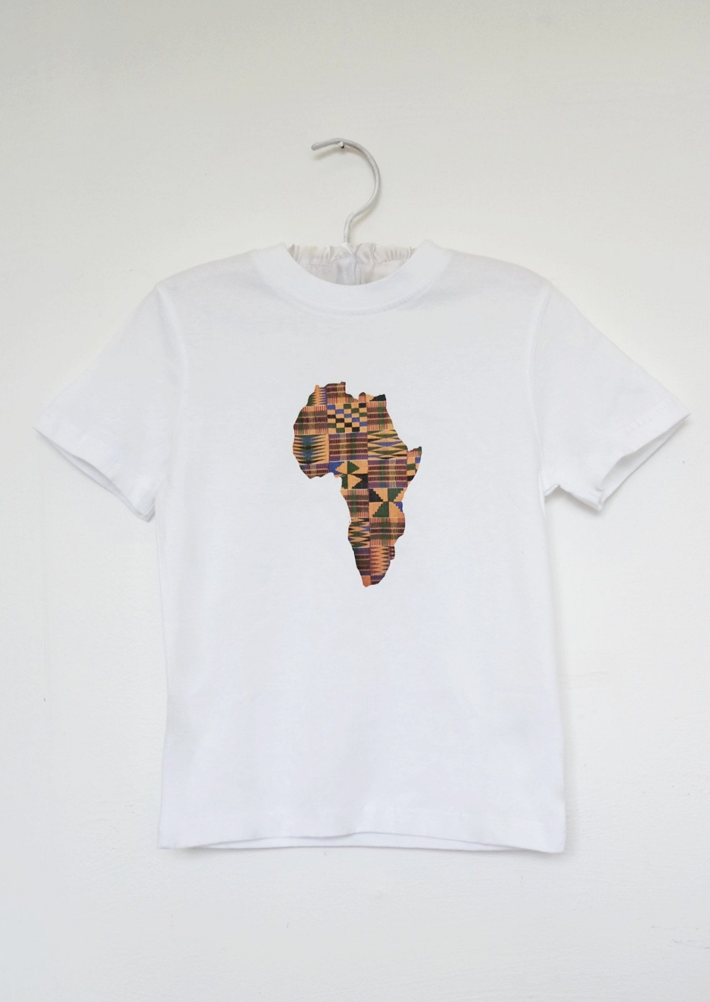 A cute boy's white short sleeve t-shirt with gold map of Africa graphic on the centre.