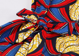 The Abi is a red and blue high low dress that can also be worn as a dress top over leggings. The asymmetric dress has a zip up the back, and is a sleeveless dress and a round neck dress. The Ankara Style African dress can be dressed up or down for any occasion.  Edit alt text