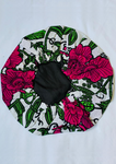 A beautiful floral print bonnet, the satin sleeping cap comes with pink flowers and green vines splashed across the material.