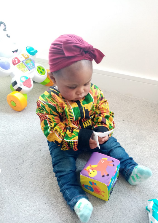 Girls bomber jacket in kente print.