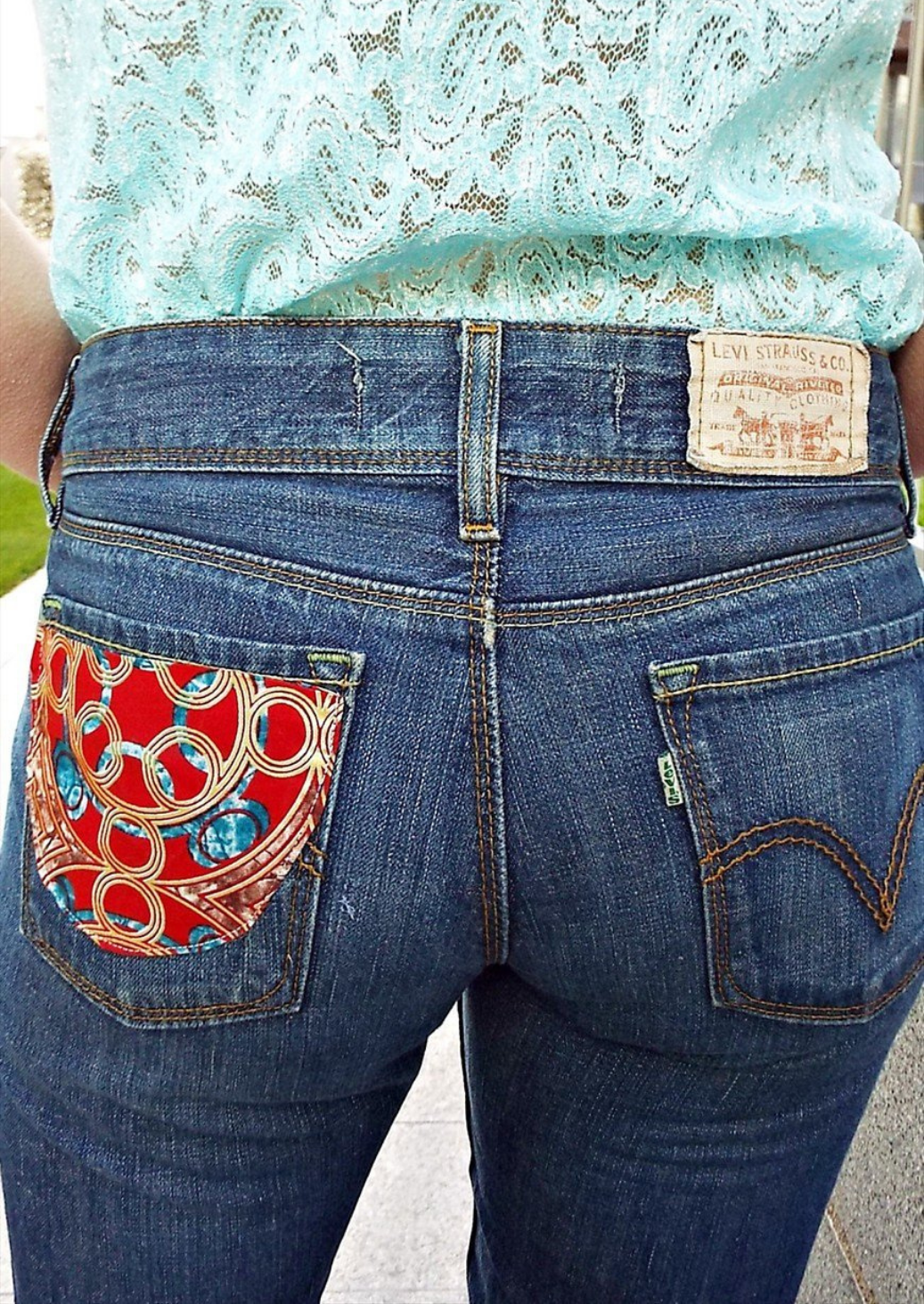 Vintage 90s blue Levi jeans with African print patch.