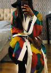 Multicoloured African print kimono for women. The kimono is lined and has a belt.