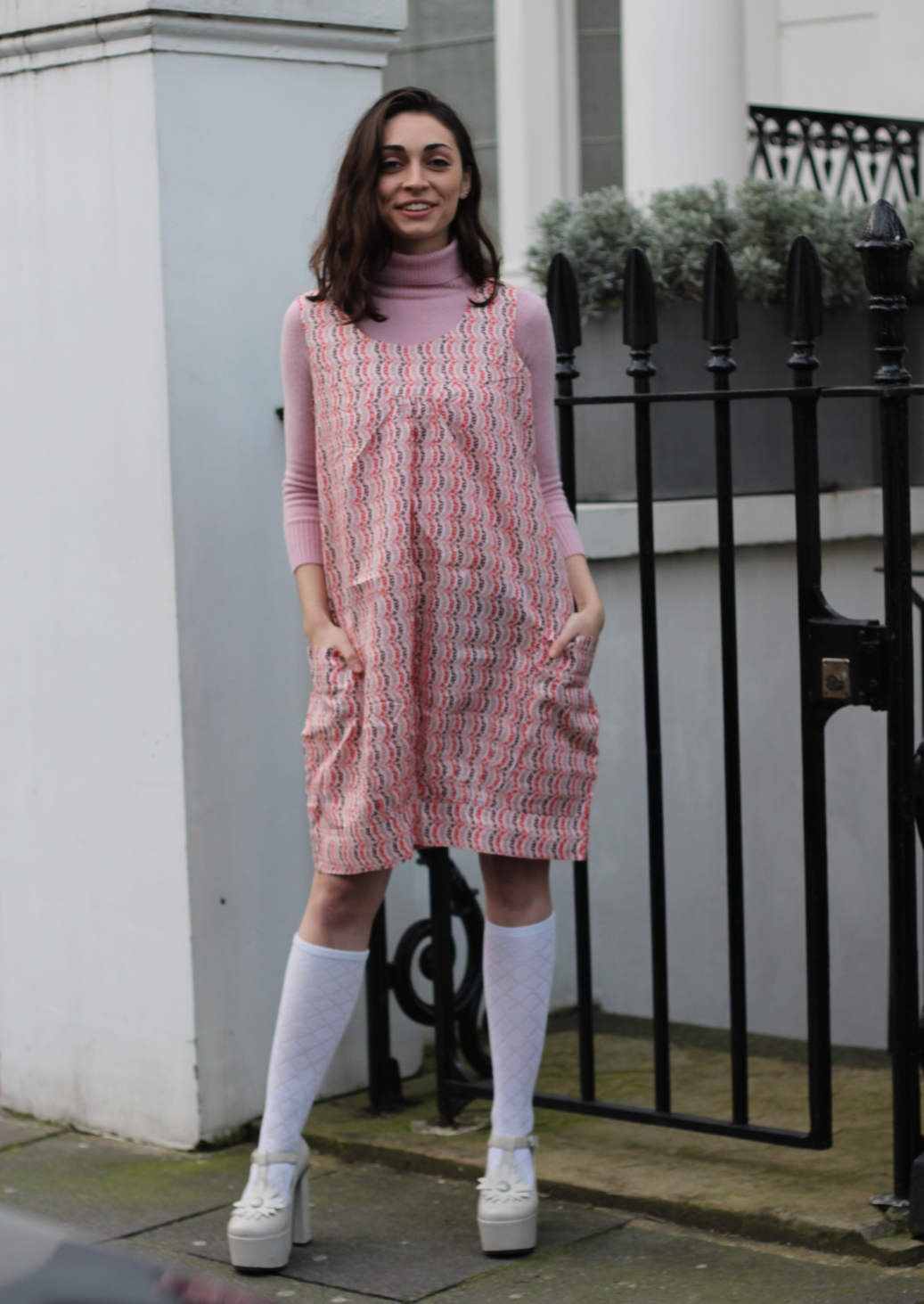 An African BouBou dress, The Kemi is styled like a pink kaftan dress creating a chic feminine look. The pink African print dress is perfect for both work and social occasions, the Ankara style pink midi dress with scoop neckline being comfortable to wear and a dream to style. The dress with pockets can be dressed up or down.