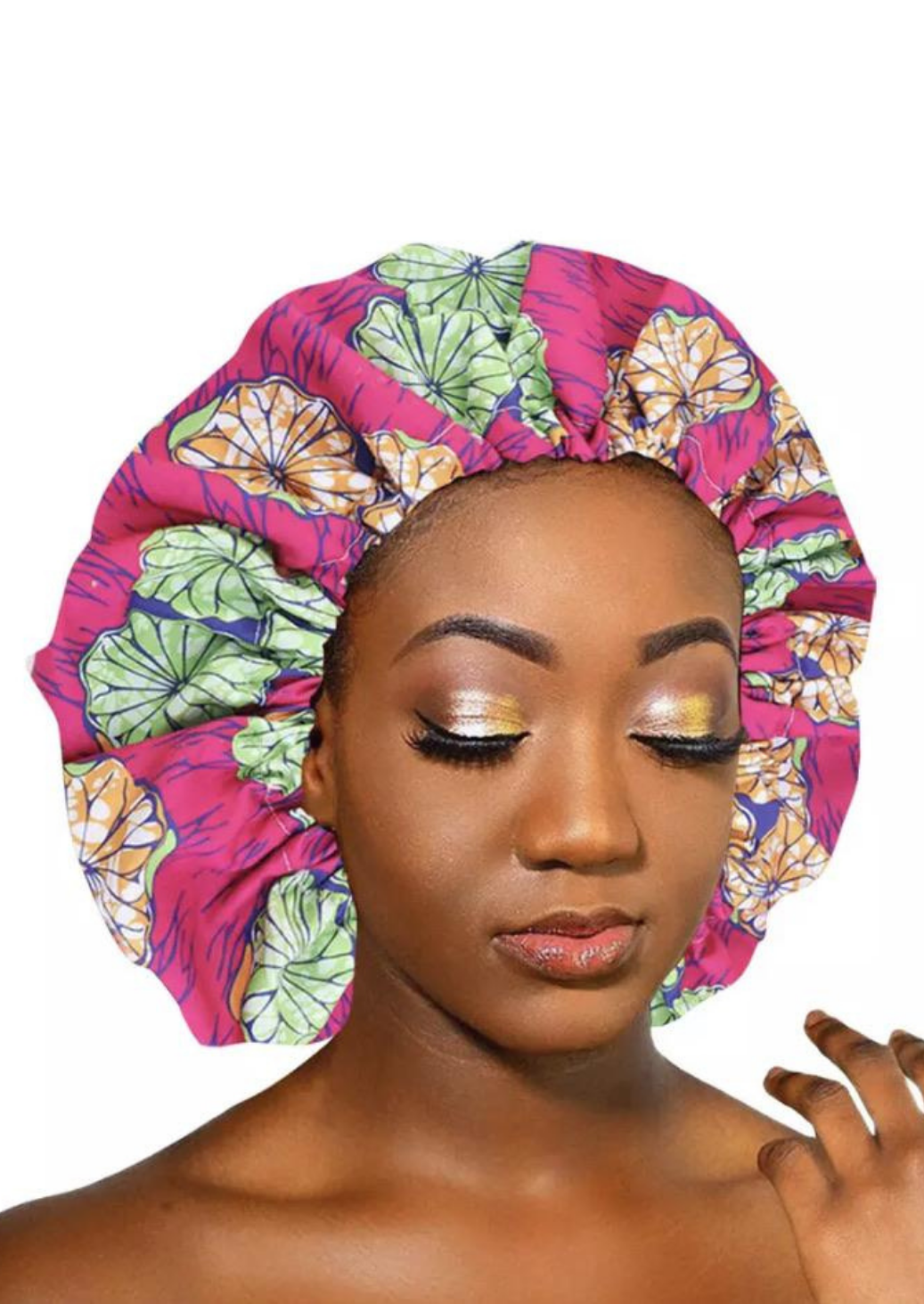 A beautiful pink African silk bonnet, The Buki Ankara bonnet is satin lined with elastic to ensure the sleep cap is comfortable to wear. Our pink satin cap is perfect for braids, locx, weaves, crochet and natural hair.