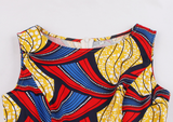 The Abi is a red and blue high low dress that can also be worn as a dress top over leggings. The asymmetric dress has a zip up the back, and is a sleeveless dress and a round neck dress. The Ankara Style African dress can be dressed up or down for any occasion.  Edit alt text