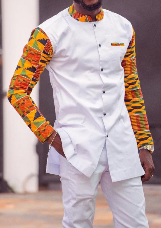 White button up men's shirt with African print detailing. The Lekan in white comprises of a white shirt, enhanced by kente print sleeves, collar and pocket.