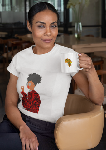 White short sleeve t-shirt for women. The white round neck t-shirt features a graphic of a woman wearing African print clothing.